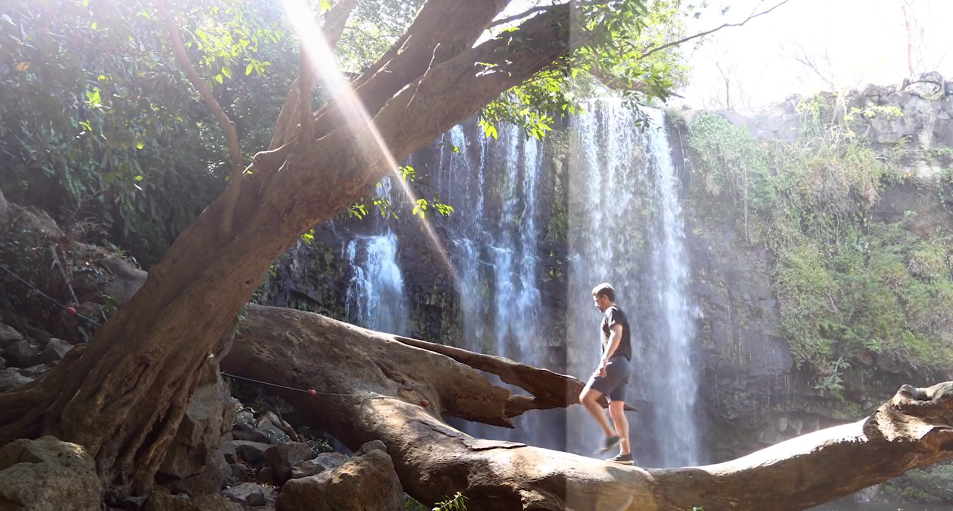 Specialty LUT applied to overexposed footage of a man walking by a waterfall.